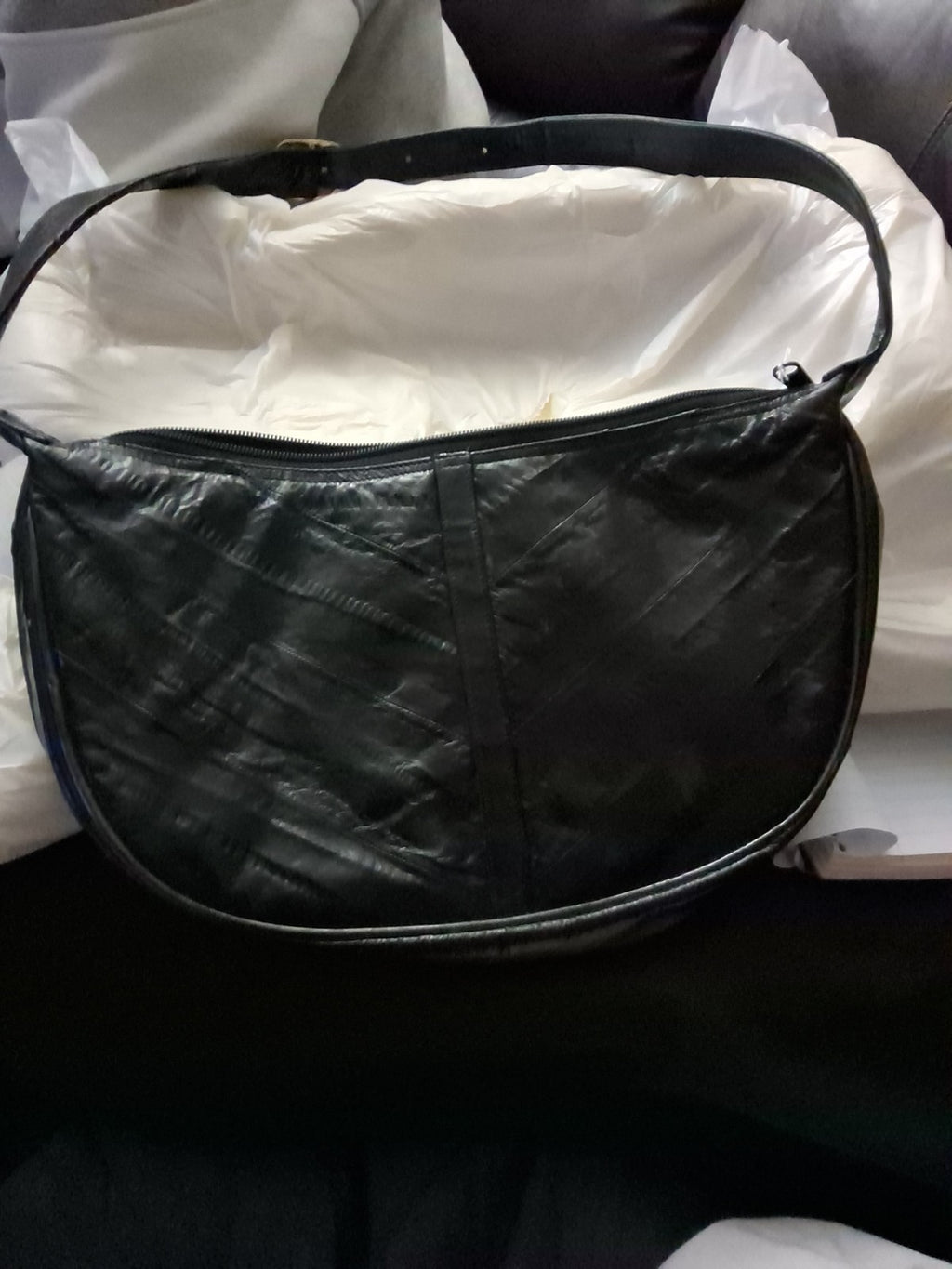 This item is a vintage black genuine eel skin hobo shoulder bag