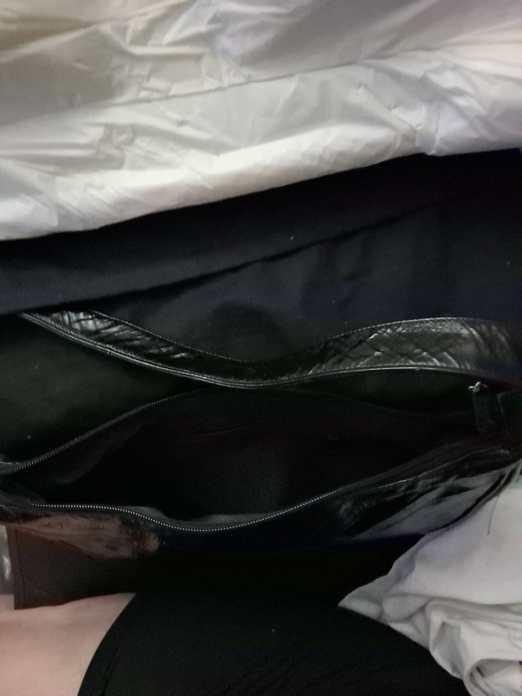 This item is a vintage black genuine eel skin hobo shoulder bag