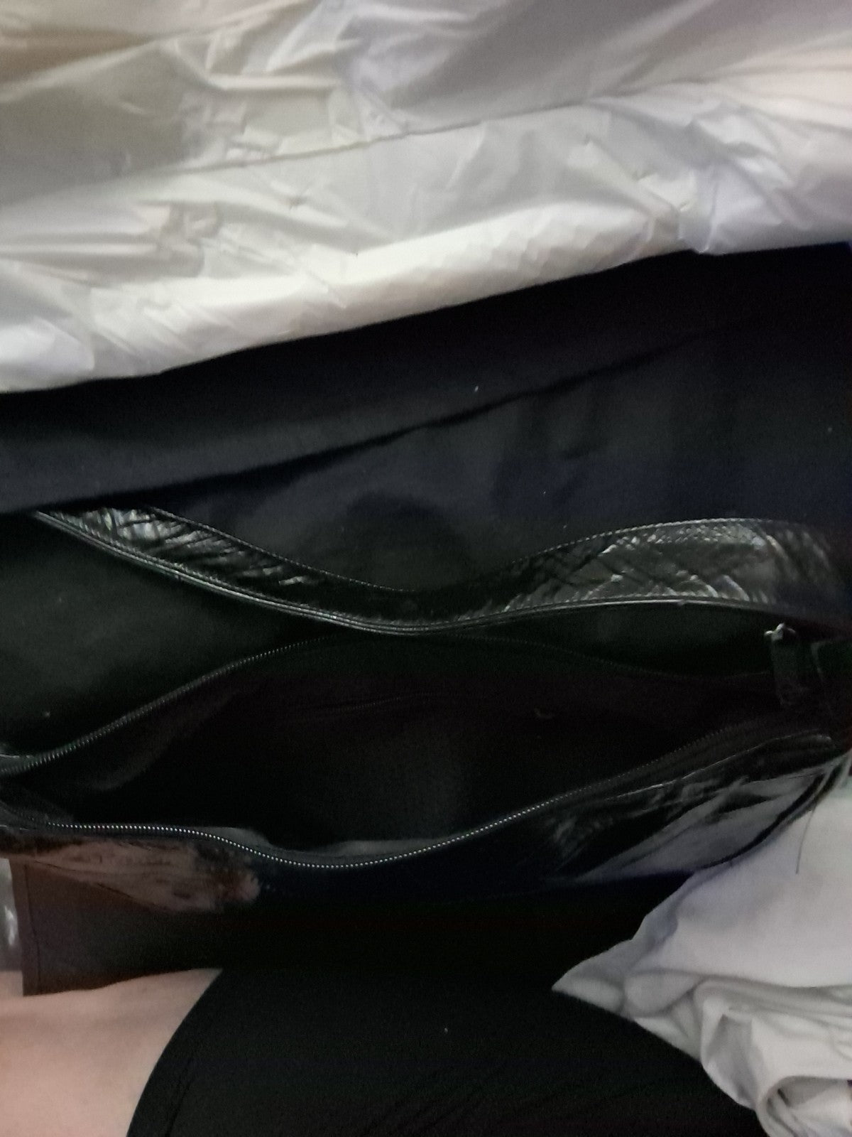 This item is a vintage black genuine eel skin hobo shoulder bag