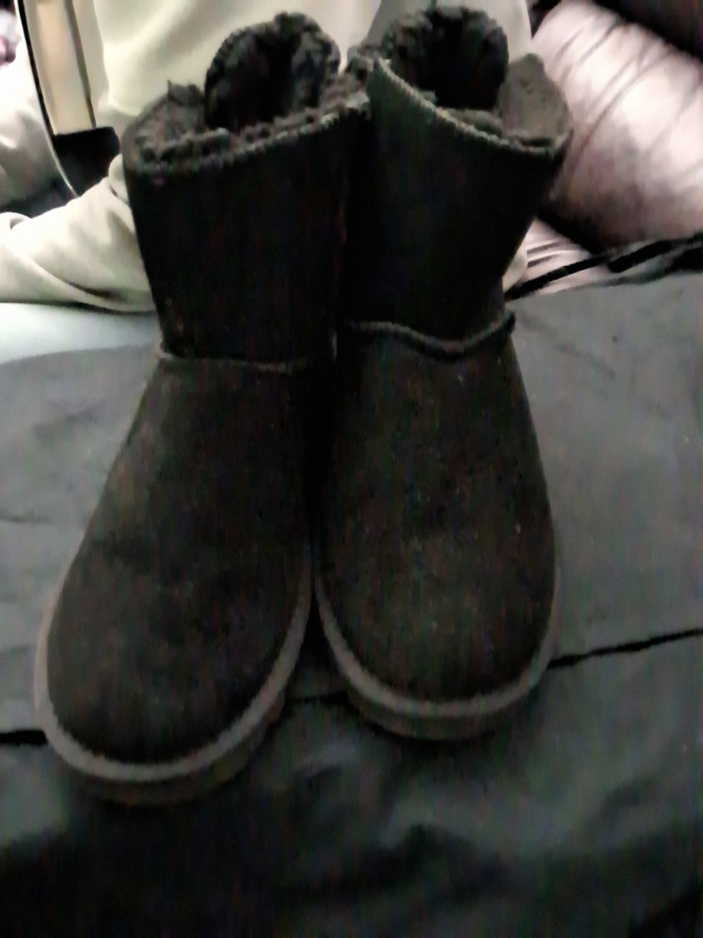 The UGG Bailey Bow II boots are a stylish addition to any wardrobe.