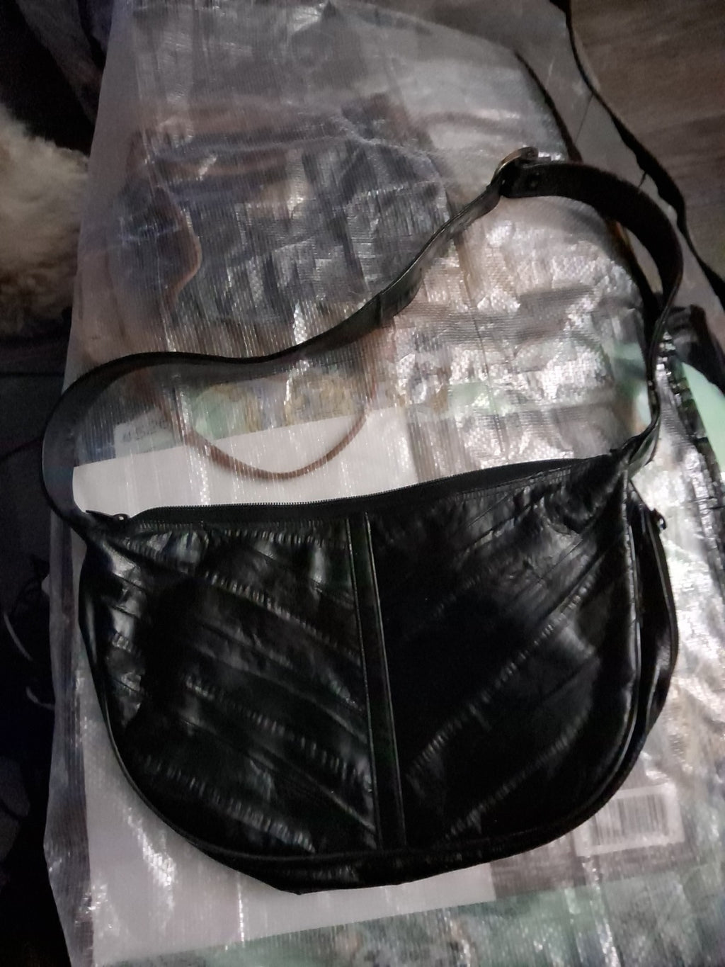 This item is a vintage black genuine eel skin hobo shoulder bag