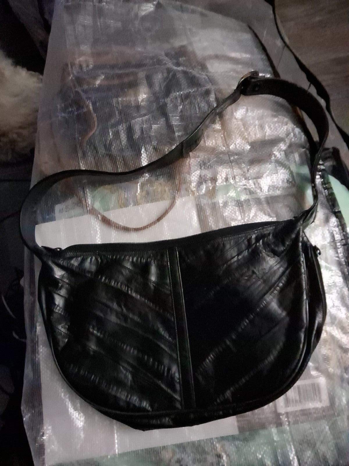This item is a vintage black genuine eel skin hobo shoulder bag