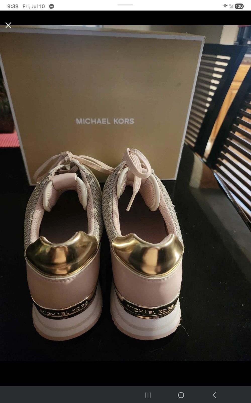 These Michael Kors sneakers are a shimmering highlight, featuring a stylish mix
