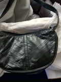 This item is a vintage black genuine eel skin hobo shoulder bag