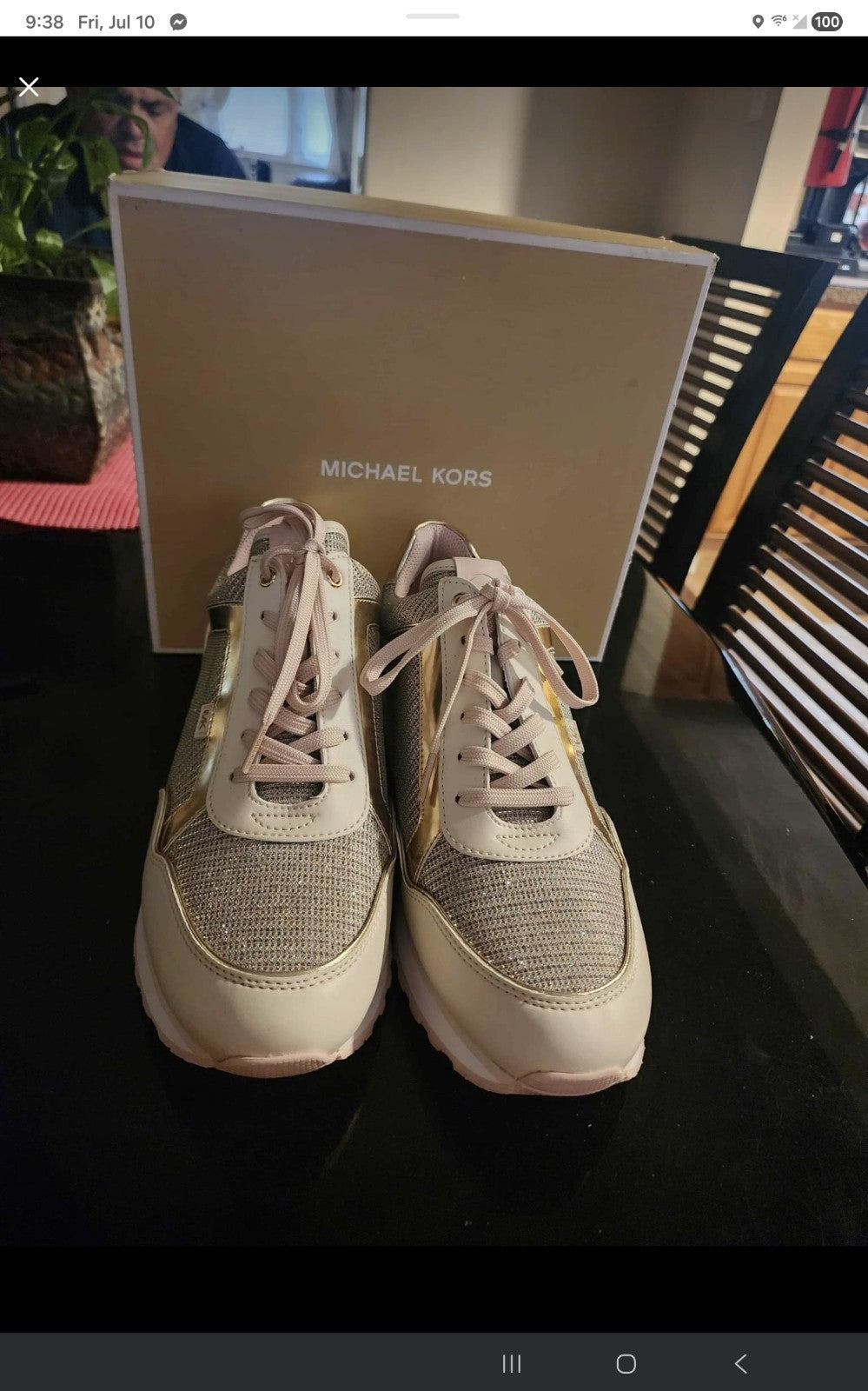 These Michael Kors sneakers are a shimmering highlight, featuring a stylish mix