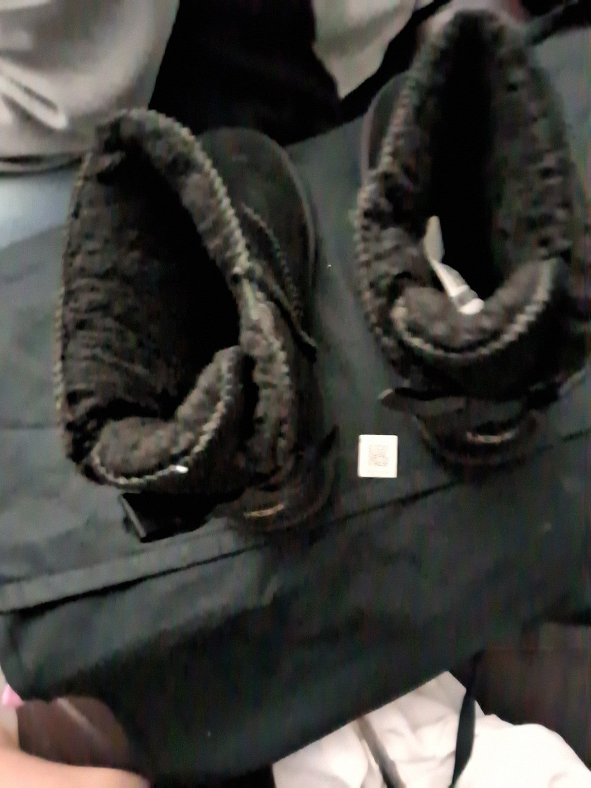 These black UGG Bailey Bow II boots feature a suede upper and a fixed satin bow