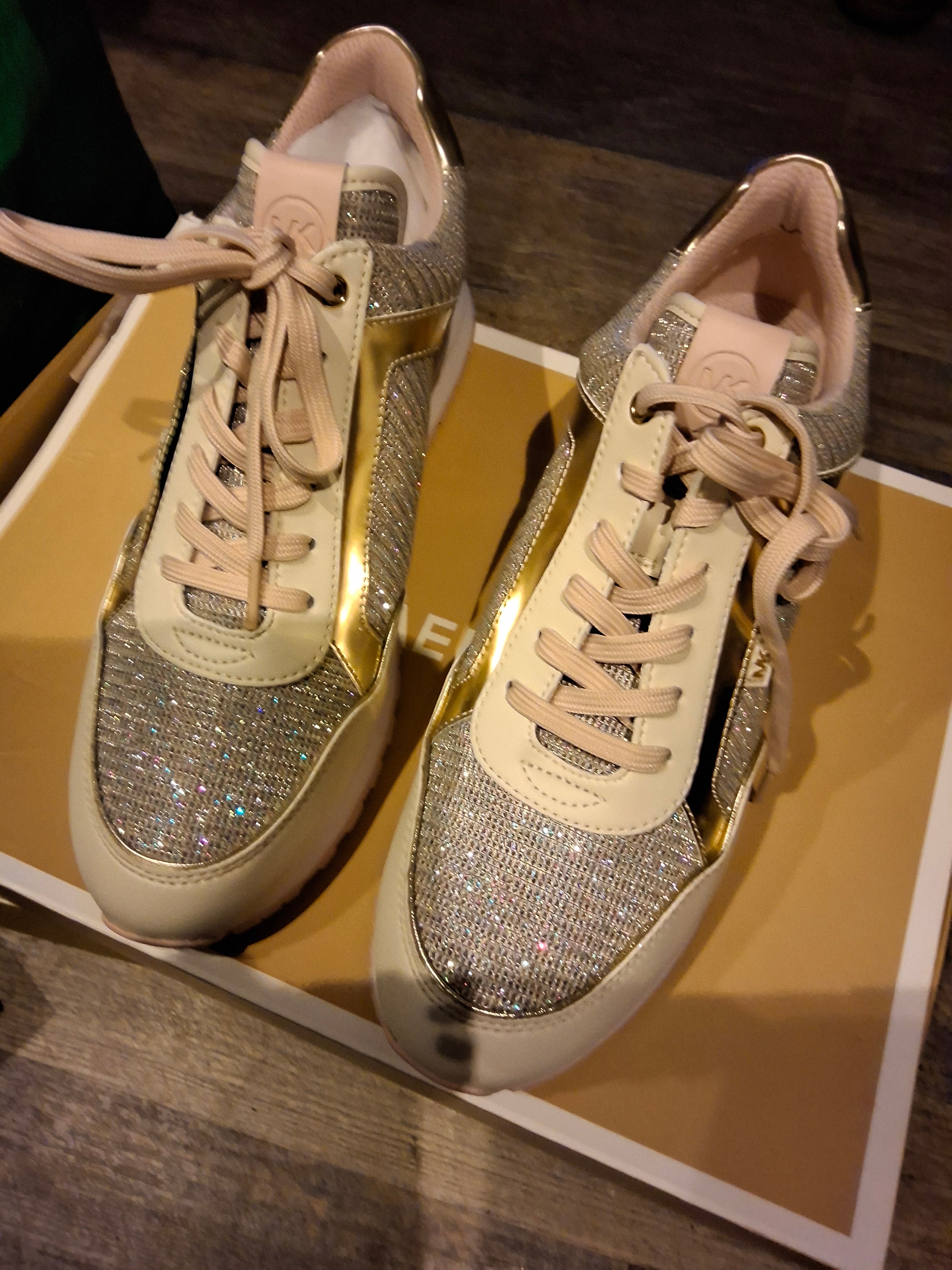 The Michael Kors Maddy Trainer is a sport-luxe low-top sneaker designed with a signature glam-athleisure aesthetic. #69